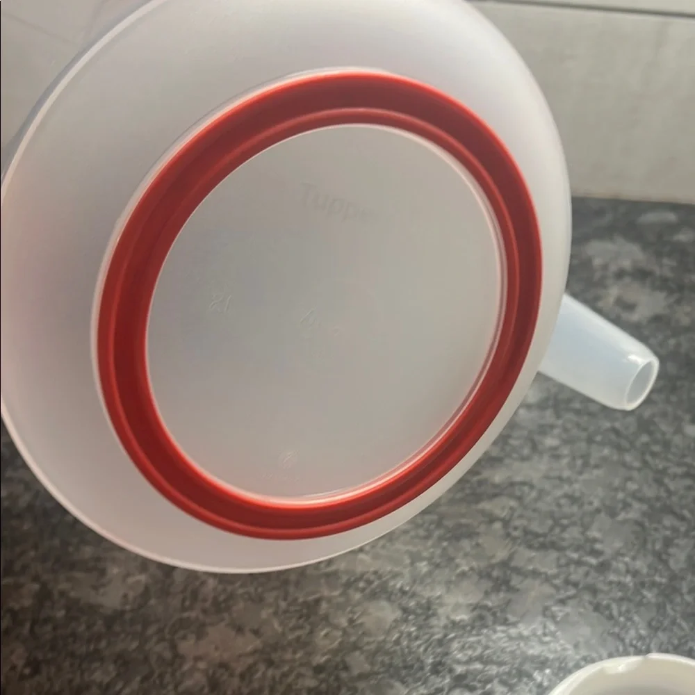 Tupperware Mix n Store Red and White Measuring cup. New without tags